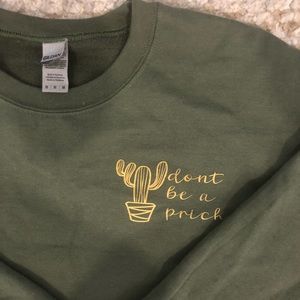 Light green crew neck with Cacti and cheeky message “don’t be a prick”